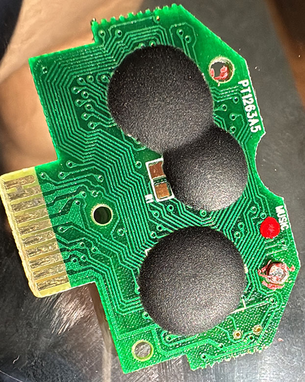 Pixture of a Pixter Classic cart insides featuring three black blobs and not much else