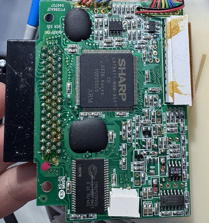 Motherboard shot of the Pixter Color Motherboard with a large central TQFP chip and a lot of black blobs