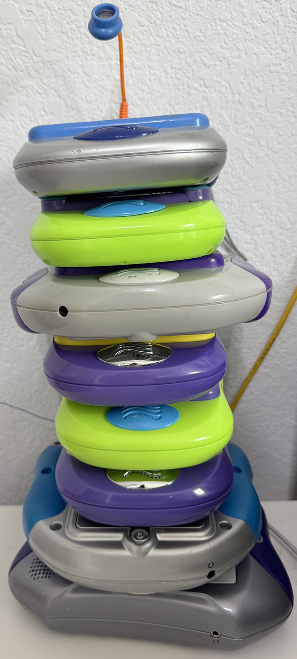 A tower of Pixter devices against a light grey wall